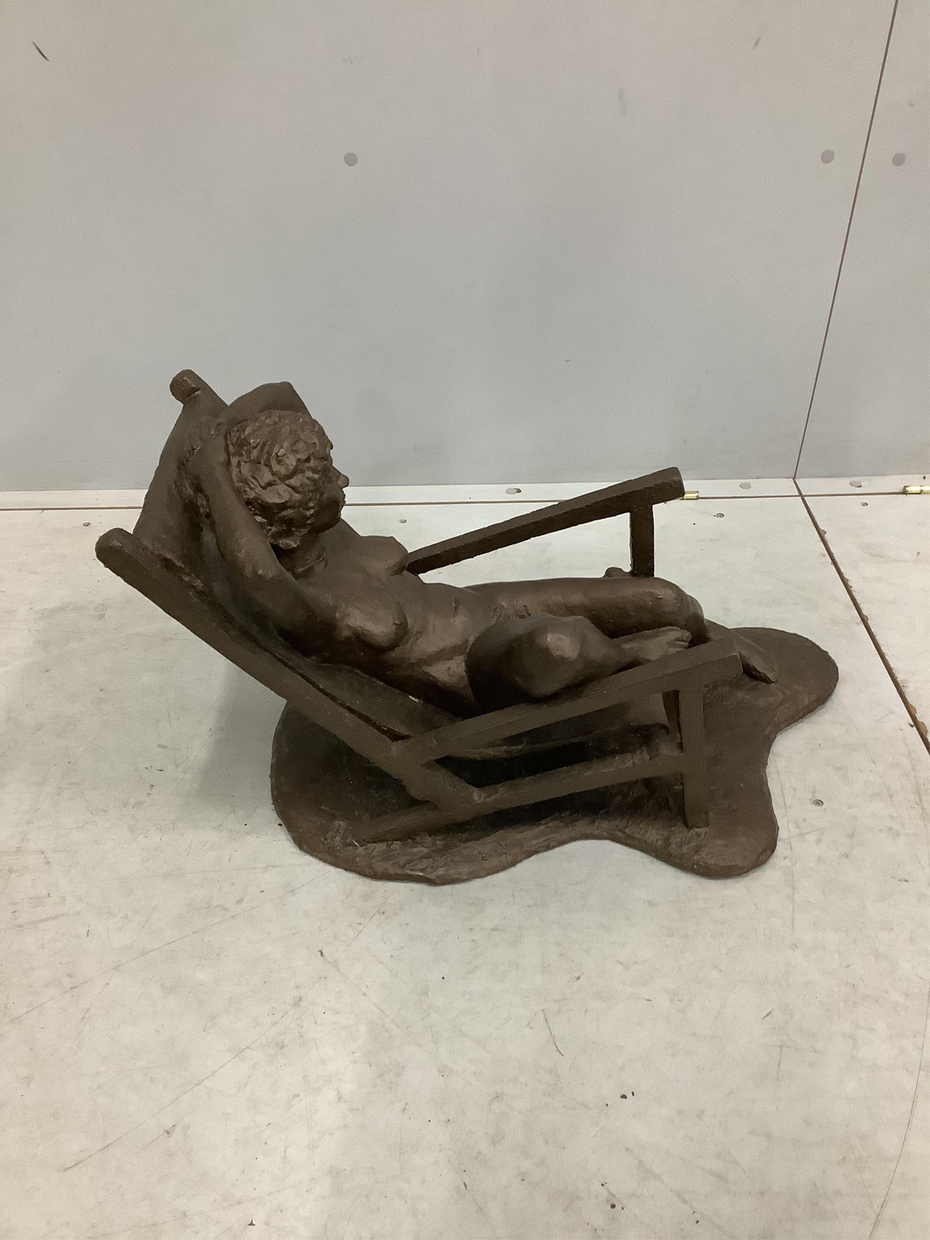 Norman Barrow (Modern British) a bronzed composition sculpture, female nude reclining in a chair, height 39cm. Condition - fair